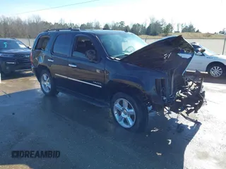 2009 Chevrolet Tahoe LTZ z VIN 1GNFK33049R297484, wystawiony jako IAAI lot #41305771 z przebiegiem 270 024 mil mil oraz . Historia ofert i sprzedaży dostępna na DreamBid. Obrazek 1.
