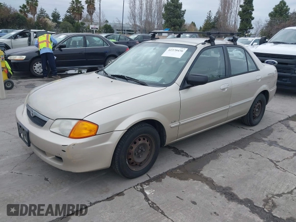 2000 Mazda Protege DX with VIN JM1BJ2223Y0212144, listed as a IAAI auction lot 41570436 with 221,430 mi miles and . Bid and sale history available at DreamBid. Image 2.