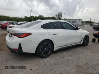 2023 BMW i4 eDrive40 with VIN WBY73AW0XPFN60228, listed as a Copart auction lot 61875624 with 21,597 mi miles and Salvage Title. Bid and sale history available at carsss.com. Image 3.