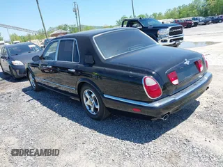 1999 Bentley Arnage z VIN SCBLB51E1XCX01401, wystawiony jako IAAI lot #42133144 z przebiegiem 29 699 mil mil oraz . Historia ofert i sprzedaży dostępna na DreamBid. Obrazek 3.