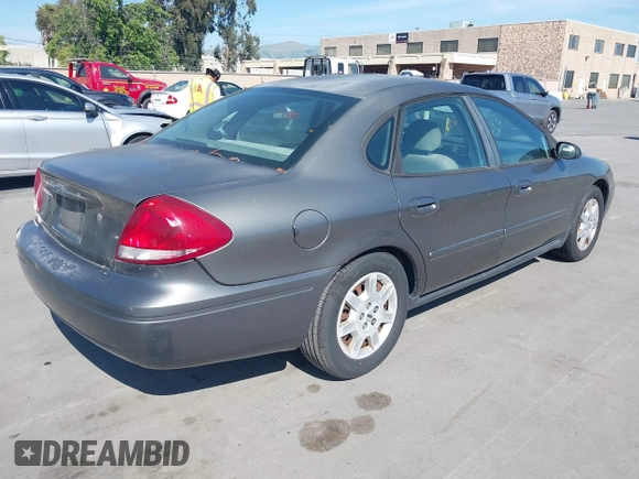 2005 Ford Taurus SE with VIN 1FAFP53U95A289971, listed as a IAAI auction lot 42143134 with 167,702 mi miles. Bid and sale history available at carsss.com. Image 4.