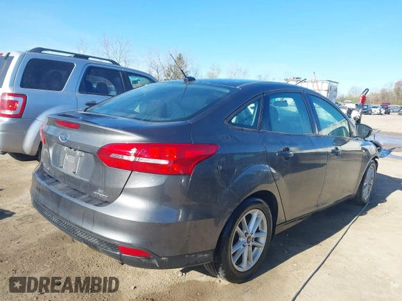 2016 Ford Focus SE with VIN 1FADP3F26GL233564, listed as a IAAI auction lot 42083597 with 153,404 mi miles and . Bid and sale history available at DreamBid. Image 4.
