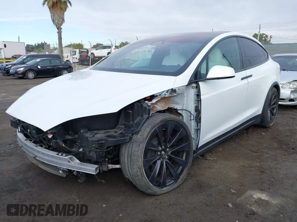 2023 Tesla Model X with VIN 7SAXCBE54PF384403, listed as a IAAI auction lot 40947187 with 16,881 mi miles and . Bid and sale history available at DreamBid. Image 2.