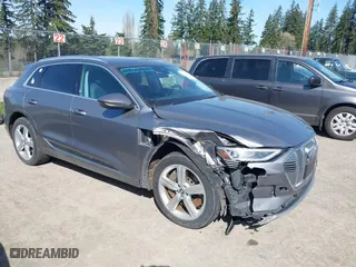 2019 Audi e-tron Premium Plus with VIN WA1LAAGE4KB012574, listed as a IAAI auction lot 41916641 with 104,911 mi miles. Bid and sale history available at carsss.com. Image 1.