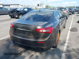 2015 Maserati Ghibli S Q4 with VIN ZAM57RTA7F1154097, listed as a IAAI auction lot 42568564 with 113,436 mi miles and . Bid and sale history available at DreamBid. Image 4.