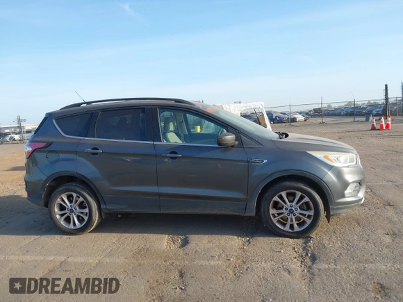 2017 Ford Escape SE with VIN 1FMCU0GD1HUE75697, listed as a IAAI auction lot 42077385 with 160,634 mi miles and . Bid and sale history available at DreamBid. Image 13.