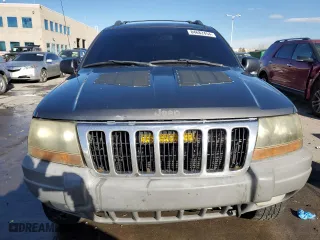 1999 Jeep Grand Cherokee Laredo with VIN 1J4GW58N9XC633464, listed as a Copart auction lot 84682454 with 212,738 mi miles and Salvage Title. Bid and sale history available at carsss.com. Image 5.