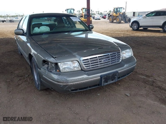 1999 Ford Crown Victoria LX with VIN 2FAFP74W9XX233325, listed as a IAAI auction lot 40934834 with 176,845 mi miles. Bid and sale history available at carsss.com. Image 6.