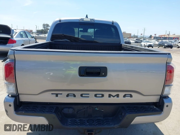 2021 Toyota Tacoma SR with VIN 3TMCZ5AN6MM393306, listed as a IAAI auction lot 42094095 with 57,217 mi miles and . Bid and sale history available at DreamBid. Image 16.