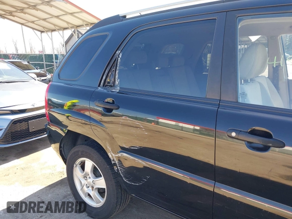 2007 Kia Sportage LX with VIN KNDJF724877313178, listed as a IAAI auction lot 41863492 with 199,138 mi miles. Bid and sale history available at carsss.com. Image 6.