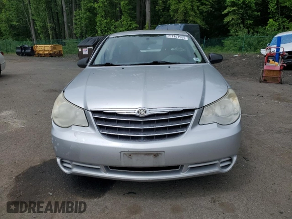 2010 Chrysler Sebring Touring z VIN 1C3CC4FB3AN203543, wystawiony jako Copart lot #57767985 z przebiegiem 152 951 mil mil oraz Szkoda całkowita • Salvage title. Historia ofert i sprzedaży dostępna na DreamBid. Obrazek 5.