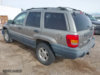 1999 Jeep Grand Cherokee Laredo with VIN 1J4GW58S6XC613307, listed as a IAAI auction lot 41592687 with 264,176 mi miles. Bid and sale history available at carsss.com. Image 3.