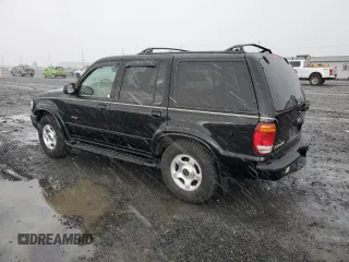 2000 Ford Explorer Limited with VIN 1FMDU75EXYZA76329, listed as a Copart auction lot 80952474 with 90,637 mi miles and Salvage title. Bid and sale history available at DreamBid. Image 2.