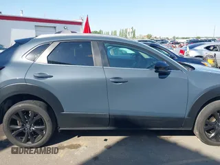 2022 Mazda CX-30 S Carbon Edition with VIN 3MVDMBCL6NM431985, listed as a IAAI auction lot 42610558 with Not provided miles and . Bid and sale history available at DreamBid. Image 12.