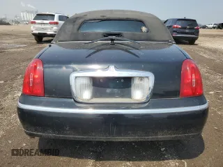 1999 Lincoln Town Car Executive with VIN 1L1FM81W8XY710157, listed as a Copart auction lot 59804965 with Not provided miles and Salvage title. Bid and sale history available at DreamBid. Image 6.