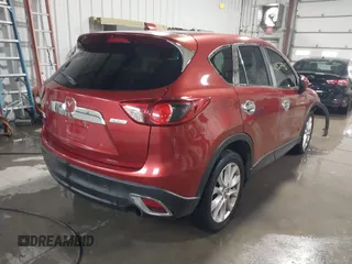 2013 Mazda CX-5 Grand Touring with VIN JM3KE2DE3D0120609, listed as a IAAI auction lot 41527942 with 215,176 mi miles. Bid and sale history available at carsss.com. Image 4.