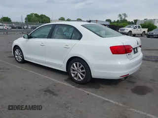 2014 Volkswagen Jetta Sedan SE w/Connectivity/Sunroof PZEV with VIN 3VWD17AJ5EM326425, listed as a IAAI auction lot 42066054 with 125,004 mi miles. Bid and sale history available at carsss.com. Image 3.