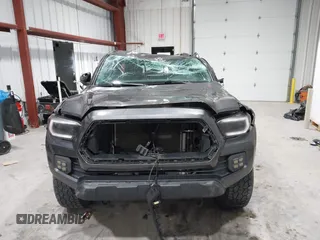 2021 Toyota Tacoma SR with VIN 3TYRX5GN8MT011370, listed as a IAAI auction lot 41287330 with 73,447 mi miles and . Bid and sale history available at DreamBid. Image 12.