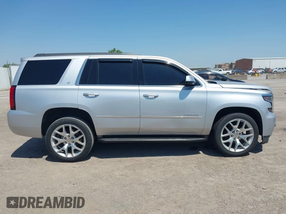 2015 Chevrolet Tahoe LT with VIN 1GNSCBKC6FR303850, listed as a IAAI auction lot 42254115 with 147,856 mi miles and . Bid and sale history available at DreamBid. Image 13.