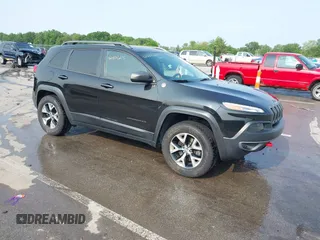 2015 Jeep Cherokee Trailhawk with VIN 1C4PJMBS6FW786622, listed as a IAAI auction lot 42403215 with 148,205 mi miles and . Bid and sale history available at DreamBid. Image 1.