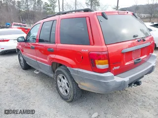 1999 Jeep Grand Cherokee Laredo with VIN 1J4GW58S0XC519908, listed as a IAAI auction lot 41789905 with 221,064 mi miles. Bid and sale history available at carsss.com. Image 3.