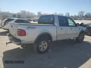2003 Ford F-150 XLT with VIN 1FTRW08L03KD74119, listed as a Copart auction lot 47373105 with 303,513 mi miles and Salvage Title. Bid and sale history available at carsss.com. Image 3.