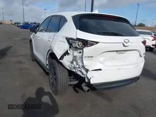 2018 Mazda CX-5 Grand Touring with VIN JM3KFADMXJ0470846, listed as a IAAI auction lot 41913533 with 54,700 mi miles and . Bid and sale history available at DreamBid. Image 6.
