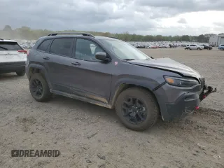 2021 Jeep Cherokee Trailhawk with VIN 1C4PJMBX7MD215581, listed as a Copart auction lot 51281205 with 62,199 mi miles and Salvage title. Bid and sale history available at DreamBid. Image 4.