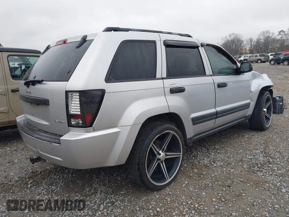 2005 Jeep Grand Cherokee Laredo z VIN 1J4GR48K05C506865, wystawiony jako IAAI lot #41539102 z przebiegiem 237 208 mil mil oraz . Historia ofert i sprzedaży dostępna na DreamBid. Obrazek 4.