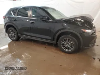 2021 Mazda CX-5 Sport with VIN JM3KFABM4M0334722, listed as a Copart auction lot 44021125 with 64,590 mi miles and Clean Title. Bid and sale history available at carsss.com. Image 4.