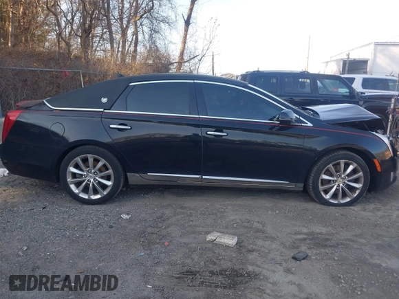 2013 Cadillac XTS Premium z VIN 2G61S5S38D9199459, wystawiony jako IAAI lot #41787638 z przebiegiem 171 298 mil mil oraz . Historia ofert i sprzedaży dostępna na DreamBid. Obrazek 13.