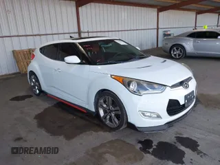 2012 Hyundai Veloster w/Gray Int z VIN KMHTC6AD0CU060801, wystawiony jako IAAI lot #41881077 z przebiegiem 113 912 mil mil oraz . Historia ofert i sprzedaży dostępna na DreamBid. Obrazek 1.