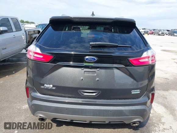 2020 Ford Edge SEL z VIN 2FMPK3J9XLBA54556, wystawiony jako IAAI lot #42179907 z przebiegiem 63 449 mil mil oraz . Historia ofert i sprzedaży dostępna na DreamBid. Obrazek 16.
