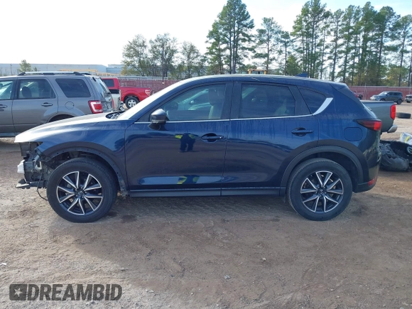 2018 Mazda CX-5 Touring z VIN JM3KFACM0J1389057, wystawiony jako IAAI lot #40922679 z przebiegiem 140 026 mil mil oraz . Historia ofert i sprzedaży dostępna na DreamBid. Obrazek 15.