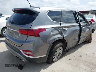 2019 Hyundai Santa Fe SE with VIN 5NMS23AD2KH108936, listed as a IAAI auction lot 42626196 with 72,757 mi miles and . Bid and sale history available at DreamBid. Image 4.