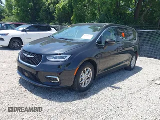 2023 Chrysler Pacifica Touring L with VIN 2C4RC1BG1PR606504, listed as a IAAI auction lot 42647652 with 41,598 mi miles and . Bid and sale history available at DreamBid. Image 19.