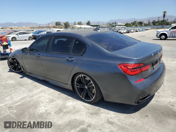 2018 BMW 7 Series 740i with VIN WBA7E2C59JG742809, listed as a Copart auction lot 66995934 with 62,017 mi miles and Salvage Title. Bid and sale history available at carsss.com. Image 2.