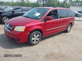 2010 Dodge Grand Caravan SXT with VIN 2D4RN5D17AR145958, listed as a IAAI auction lot 42125450 with 229,790 mi miles and . Bid and sale history available at DreamBid. Image 2.