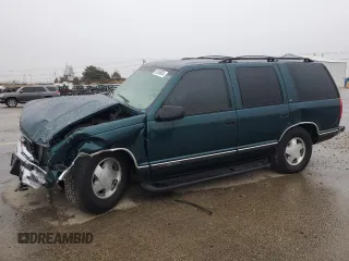 1999 GMC Yukon with VIN 1GKEK13R8XJ798496, listed as a Copart auction lot 81506634 with 117,726 mi miles and Salvage Title. Bid and sale history available at carsss.com. Image 1.