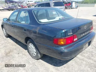 1995 Toyota Camry LE z VIN 4T1SK12E3SU576500, wystawiony jako IAAI lot #42186816 z przebiegiem 216 809 mil mil oraz . Historia ofert i sprzedaży dostępna na DreamBid. Obrazek 3.