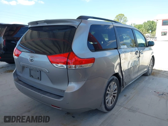 2011 Toyota Sienna XLE AAS with VIN 5TDYK3DC1BS007820, listed as a IAAI auction lot 41935200 with 123,554 mi miles. Bid and sale history available at carsss.com. Image 4.