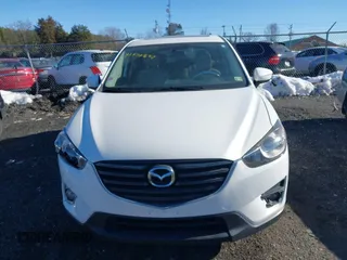 2016 Mazda CX-5 Touring with VIN JM3KE4CYXG0917841, listed as a IAAI auction lot 41420641 with 75,710 mi miles. Bid and sale history available at carsss.com. Image 12.