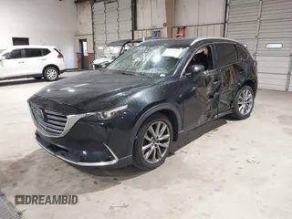 2016 Mazda CX-9 Signature z VIN JM3TCBEY5G0111286, wystawiony jako IAAI lot #42018161 z przebiegiem 155 920 mil mil oraz . Historia ofert i sprzedaży dostępna na DreamBid. Obrazek 18.