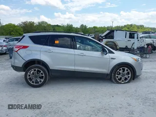 2016 Ford Escape SE with VIN 1FMCU9G92GUC28879, listed as a IAAI auction lot 42021065 with 99,184 mi miles. Bid and sale history available at carsss.com. Image 13.