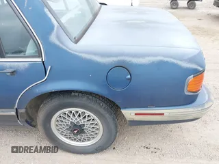 1990 Pontiac Bonneville z VIN 1G2HX54C6L1204370, wystawiony jako IAAI lot #42283309 z przebiegiem 114 427 mil mil oraz . Historia ofert i sprzedaży dostępna na DreamBid. Obrazek 6.