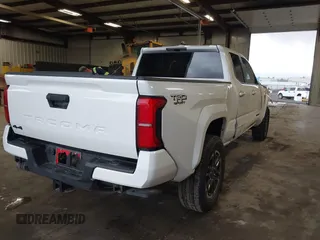 2025 Toyota Tacoma SR with VIN 3TMLB5JN2SM090394, listed as a IAAI auction lot 41916312 with 840 mi miles and . Bid and sale history available at DreamBid. Image 4.