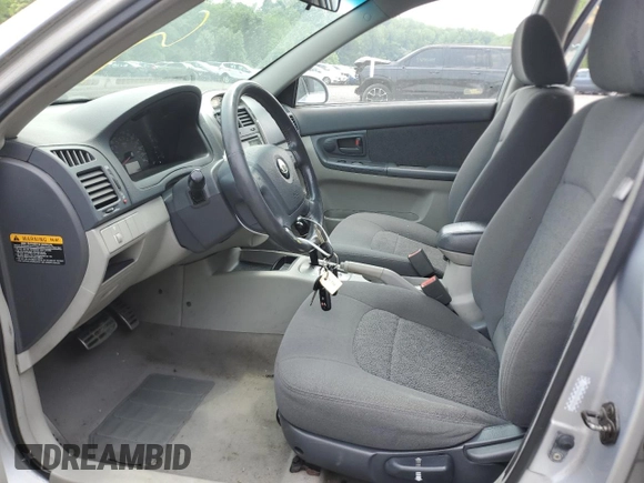 2005 Kia Spectra z VIN KNAFE162755170129, wystawiony jako Copart lot #60217065 z przebiegiem 94 458 mil mil oraz Szkoda całkowita • Salvage title. Historia ofert i sprzedaży dostępna na DreamBid. Obrazek 7.