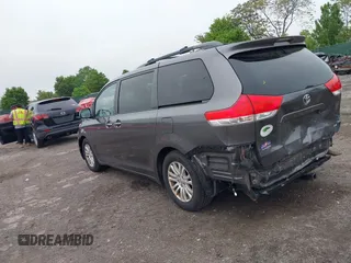 2014 Toyota Sienna XLE with VIN 5TDYK3DC0ES436502, listed as a IAAI auction lot 42180990 with 154,839 mi miles and . Bid and sale history available at DreamBid. Image 3.