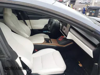 2021 Tesla Model S Long Range with VIN 5YJSA1E5XMF428519, listed as a IAAI auction lot 41926242 with 54,284 mi miles and . Bid and sale history available at DreamBid. Image 5.