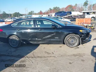 2017 Ford Fusion Titanium with VIN 3FA6P0SU2HR309895, listed as a IAAI auction lot 40963527 with 80,761 mi miles and . Bid and sale history available at DreamBid. Image 13.
